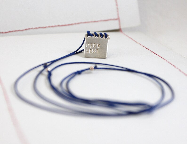 IMPRUDENTE Amuleto de plata