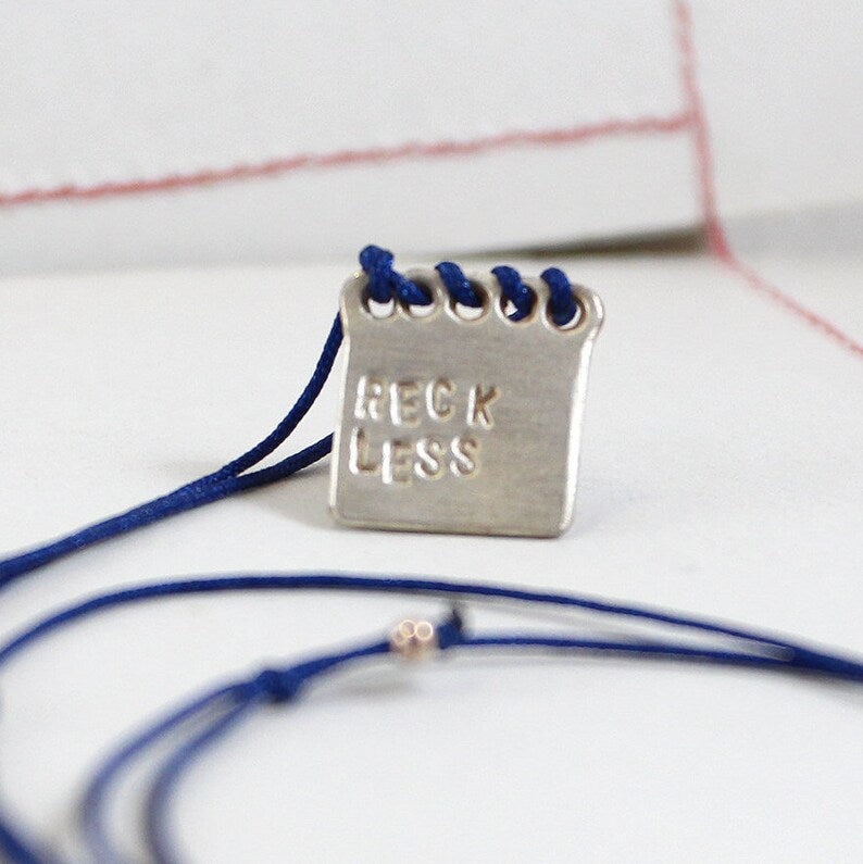 IMPRUDENTE Amuleto de plata